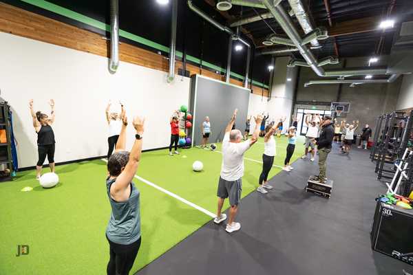 Group fitness training class at Kinetic Impact in San Diego